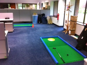 Mini golf set up at Baxter Healthcare Head Office